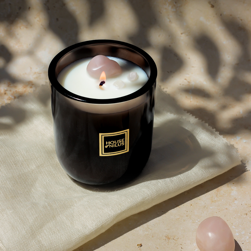 
                  
                    House of Nilus Aurora di Toscana — vegan soy candle with soft floral and citrus notes, rose quartz crystal for love and serenity.
                  
                